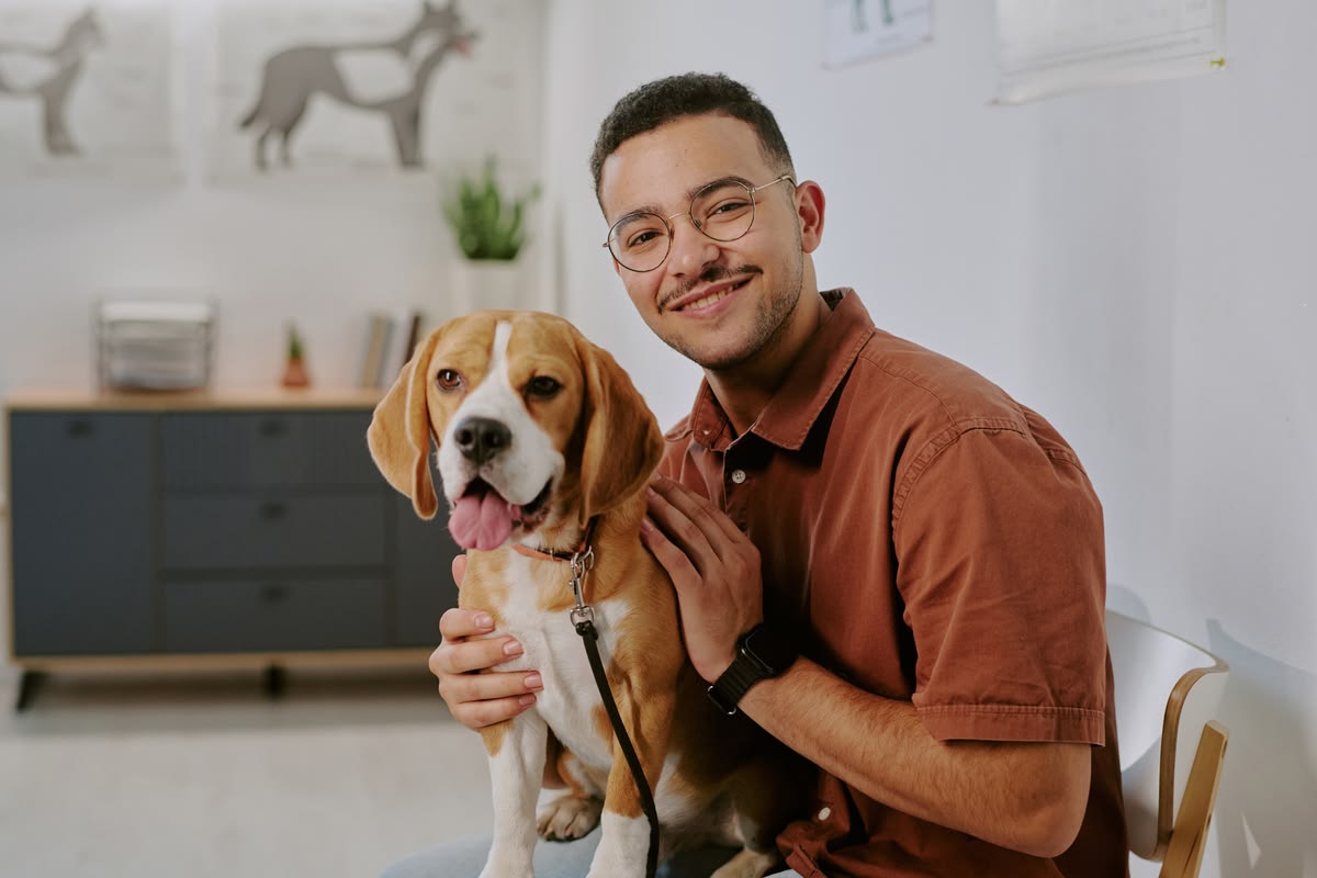 A modern apartment complex with a diverse group of residents and their pets, symbolizing advanced pet screening and compliance.